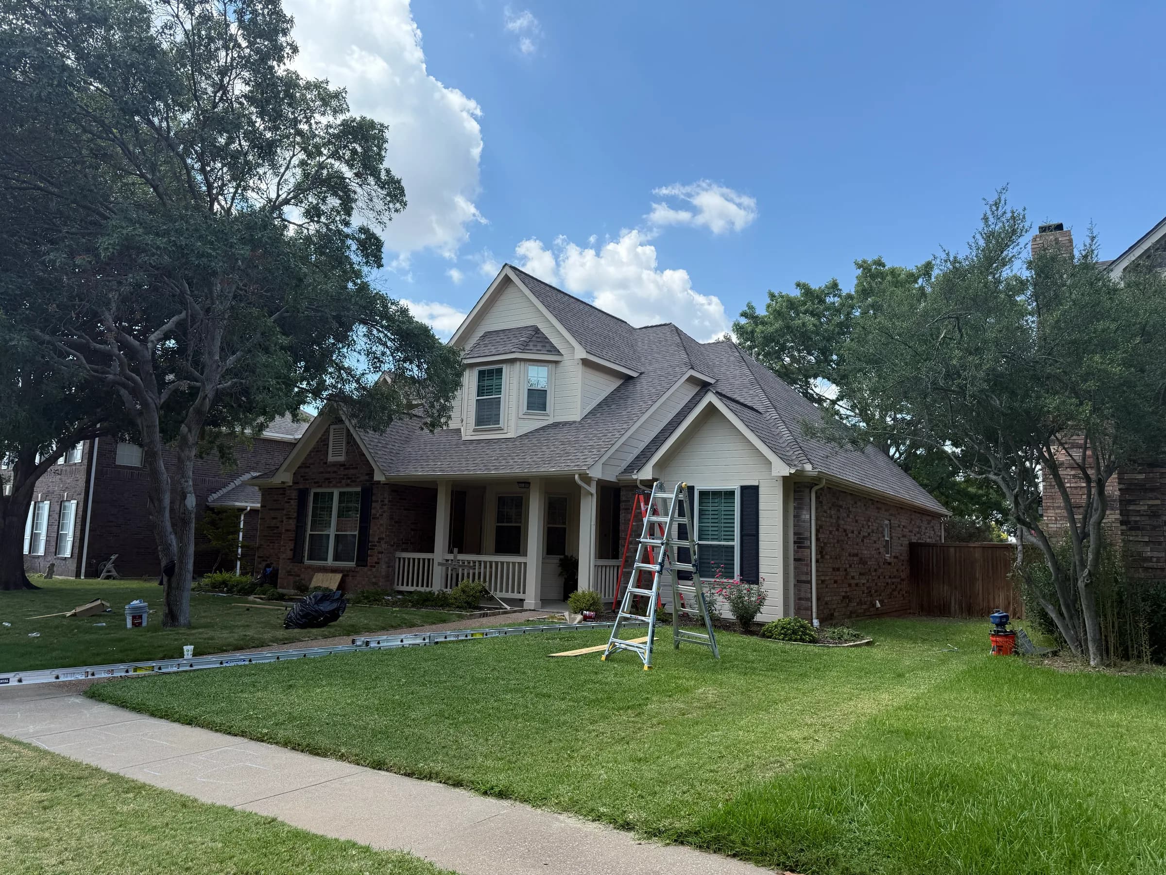 Completed exterior masonry and roofing work